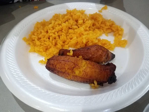 Plantain banana and yellow rice Puerto Rico food on plate — 图库照片