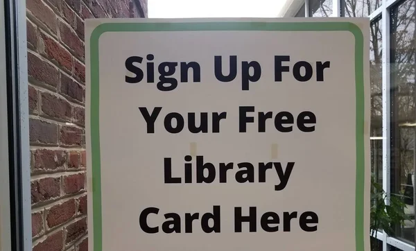 Sign up for free library card here sign on window — Stock Photo, Image