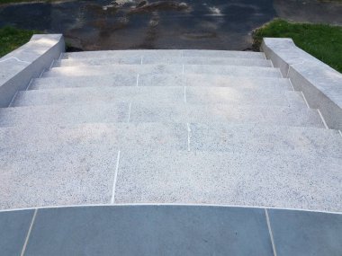 grey stone or marble tiles on stairs or steps