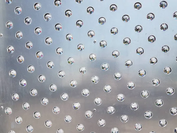 Silver metal wall with glass or crystal spheres — Stockfoto