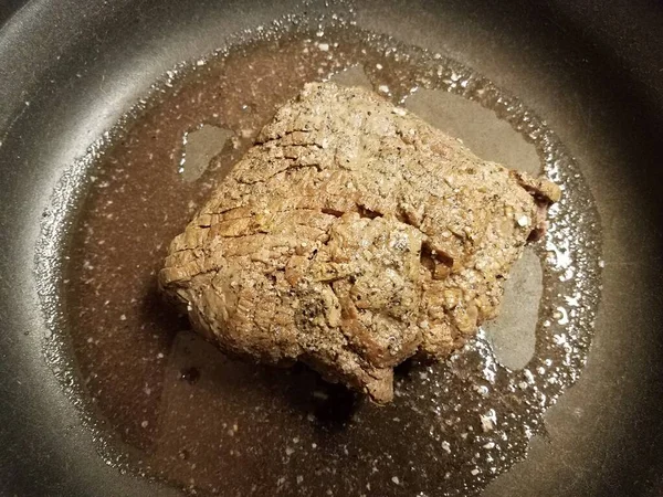 Roast beef meat cooking in frying pan — 스톡 사진