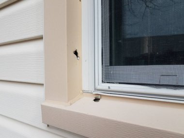 hole or damage in metal window frame