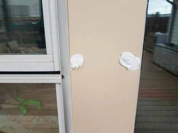 Filled hole or damage in metal window frame — 스톡 사진