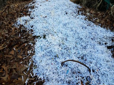 shredded white paper on compost pile or mound