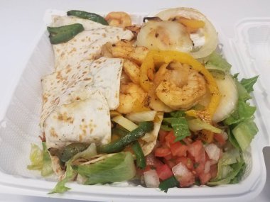 tortilla with shrimp and cheese and onion