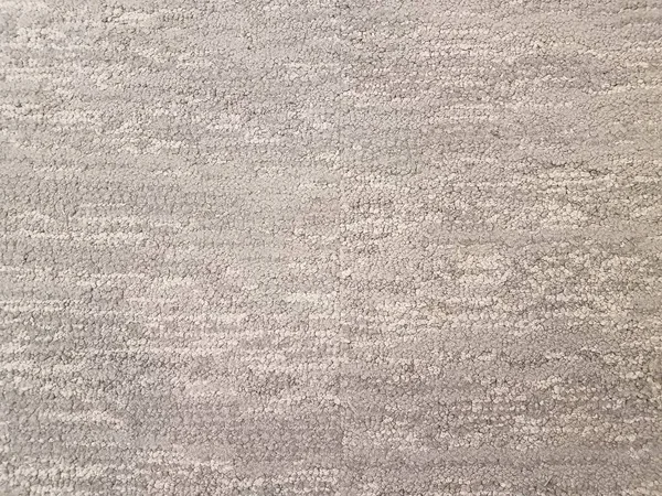 Grey carpet or rug or textile on floor or ground — Stok fotoğraf