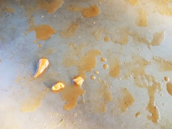 Orange liquid vomit with chunks of chicken meat — 图库照片