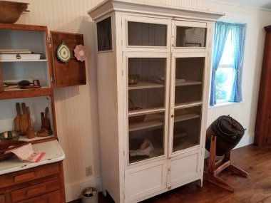 wood cupboard with screen door for storing and cooling food