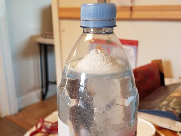 Protein powder dissolving in plastic water bottle — Stok fotoğraf