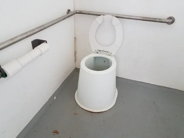 Dirty toilet with metal bars in bathroom or restroom — Stok fotoğraf