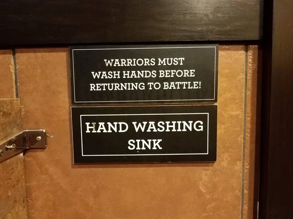 Warriors must wash hands before returning to battle sign — 图库照片