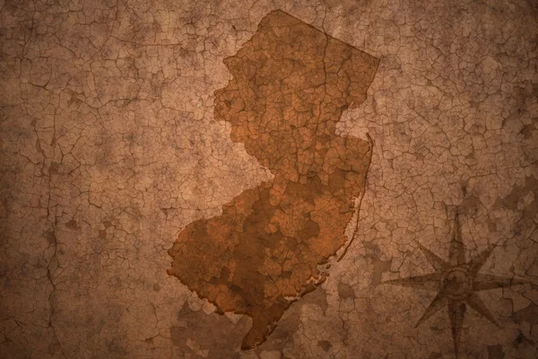 New Jersey State map on a old vintage crack paper background — стоковое фото