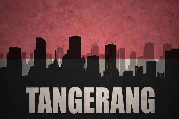 Abstract silhouette of the city with text Tangerang at the vintage indonesian flag background — ストック写真