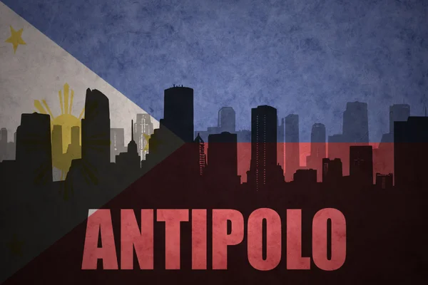 Silueta abstracta de la ciudad con texto Antipolo en el fondo de la bandera de Filipinas vintage —  Fotos de Stock