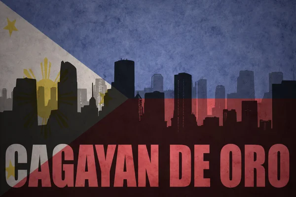 Silueta abstracta de la ciudad con texto Cagayan de Oro en el fondo de la bandera de Filipinas vintage —  Fotos de Stock