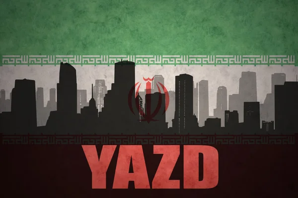 Silueta abstracta de la ciudad con texto Yazd en el fondo de la bandera iraní vintage —  Fotos de Stock