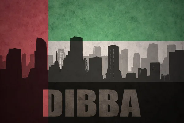 Abstract silhouette of the city with text Dibba at the vintage united arab emirates flag background — Stock Photo, Image