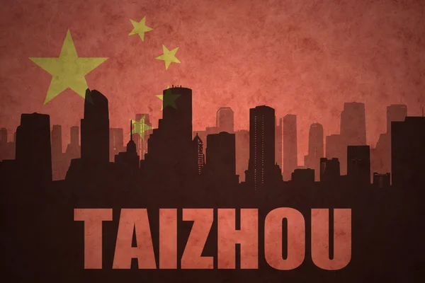 Abstract silhouette of the city with text Taizhou at the vintage chinese flag background — ストック写真