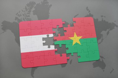 bir dünya haritası arka plan üzerinde Avusturya ve burkina faso ulusal bayrağı ile bulmaca.