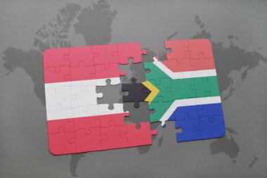 bir dünya haritası arka plan üzerinde Avusturya ve Güney Afrika ulusal bayrağı ile bulmaca.