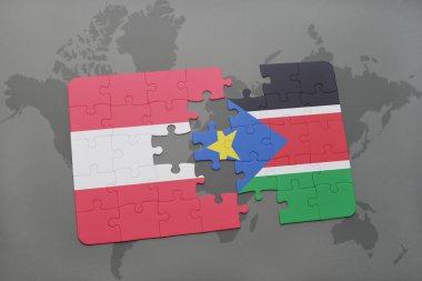 bir dünya haritası arka plan üzerinde Avusturya ve Güney Sudan ulusal bayrağı ile bulmaca.