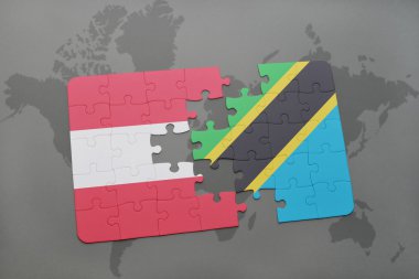 bir dünya haritası arka plan üzerinde Avusturya ve Tanzanya ulusal bayrağı ile bulmaca.