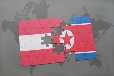 bir dünya haritası arka plan üzerinde Avusturya ve Kuzey Kore ulusal bayrağı ile bulmaca.