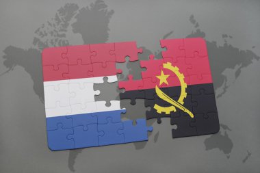 bir dünya haritası arka plan üzerinde Hollanda ve angola ulusal bayrağı ile bulmaca.