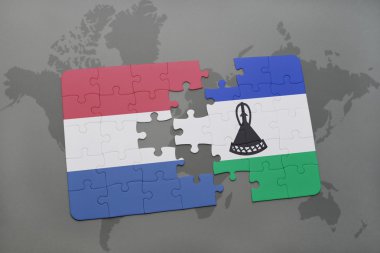 bir dünya haritası arka plan üzerinde Hollanda ve lesotho ulusal bayrağı ile bulmaca.
