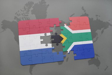 bir dünya haritası arka plan üzerinde Hollanda ve Güney Afrika ulusal bayrağı ile bulmaca.