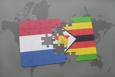 bir dünya haritası arka plan üzerinde Hollanda ve zimbabve ulusal bayrağı ile bulmaca.