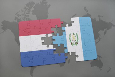 bir dünya haritası arka plan üzerinde Hollanda ve Guatemala ulusal bayrağı ile bulmaca.