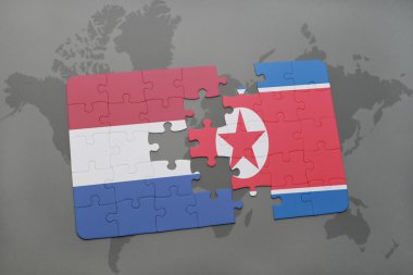 bir dünya haritası arka plan üzerinde Hollanda ve Kuzey Kore ulusal bayrağı ile bulmaca.
