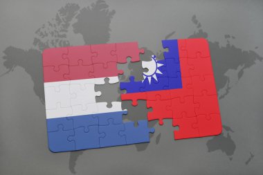 bir dünya haritası arka plan üzerinde Hollanda ve Tayvan ulusal bayrağı ile bulmaca.