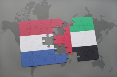 bir dünya haritası arka plan üzerinde Hollanda ve birleşik arap emirlikleri ulusal bayrağı ile bulmaca.