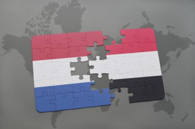 bir dünya haritası arka plan üzerinde Hollanda ve Yemen ulusal bayrağı ile bulmaca.