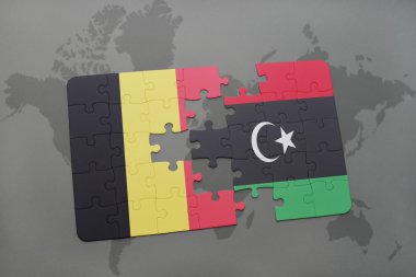 bir dünya haritası arka plan üzerinde Belçika ve Libya ulusal bayrağı ile bulmaca.