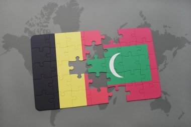 bir dünya haritası arka plan üzerinde Belçika ve Maldivler ulusal bayrağı ile bulmaca.