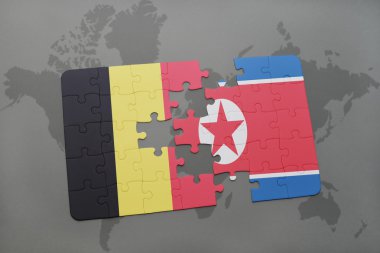 bir dünya haritası arka plan üzerinde Belçika ve Kuzey Kore ulusal bayrağı ile bulmaca.