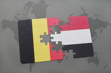 Belçika ve yemen dünya harita arka plan üzerinde bayrağı ile bulmaca.