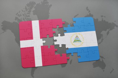 bir dünya haritası arka plan üzerinde Danimarka ve nikaragua ulusal bayrağı ile bulmaca.