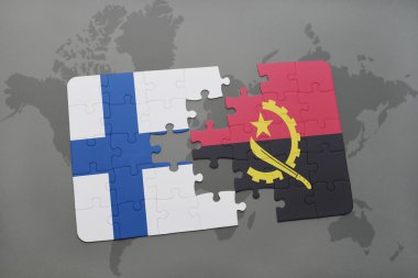 bir dünya haritası arka plan üzerinde finlandiya ve angola ulusal bayrağı ile bulmaca.