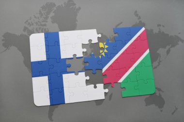 bir dünya haritası arka plan üzerinde finlandiya ve namibya ulusal bayrağı ile bulmaca.