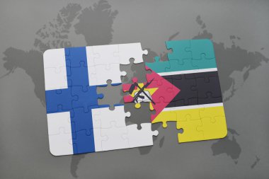 bir dünya haritası arka plan üzerinde finlandiya ve mozambik ulusal bayrağı ile bulmaca.