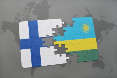 bir dünya haritası arka plan üzerinde Finlandiya ve Ruanda ulusal bayrağı ile bulmaca.