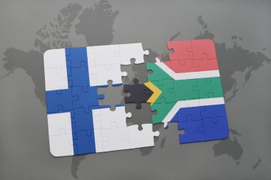 bir dünya haritası arka plan üzerinde Finlandiya ve Güney Afrika ulusal bayrağı ile bulmaca.