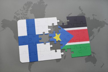 bir dünya haritası arka plan üzerinde Finlandiya ve güney sudan ulusal bayrağı ile bulmaca.