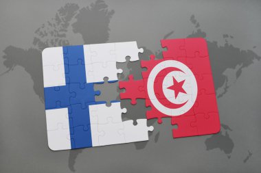 bir dünya haritası arka plan üzerinde Finlandiya ve Tunus ulusal bayrağı ile bulmaca.