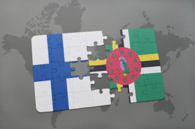 bir dünya haritası arka plan üzerinde finlandiya ve dominika ulusal bayrağı ile bulmaca.