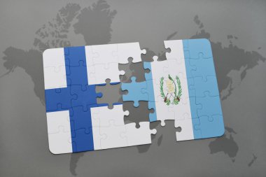 bir dünya haritası arka plan üzerinde Finlandiya ve Guatemala ulusal bayrağı ile bulmaca.